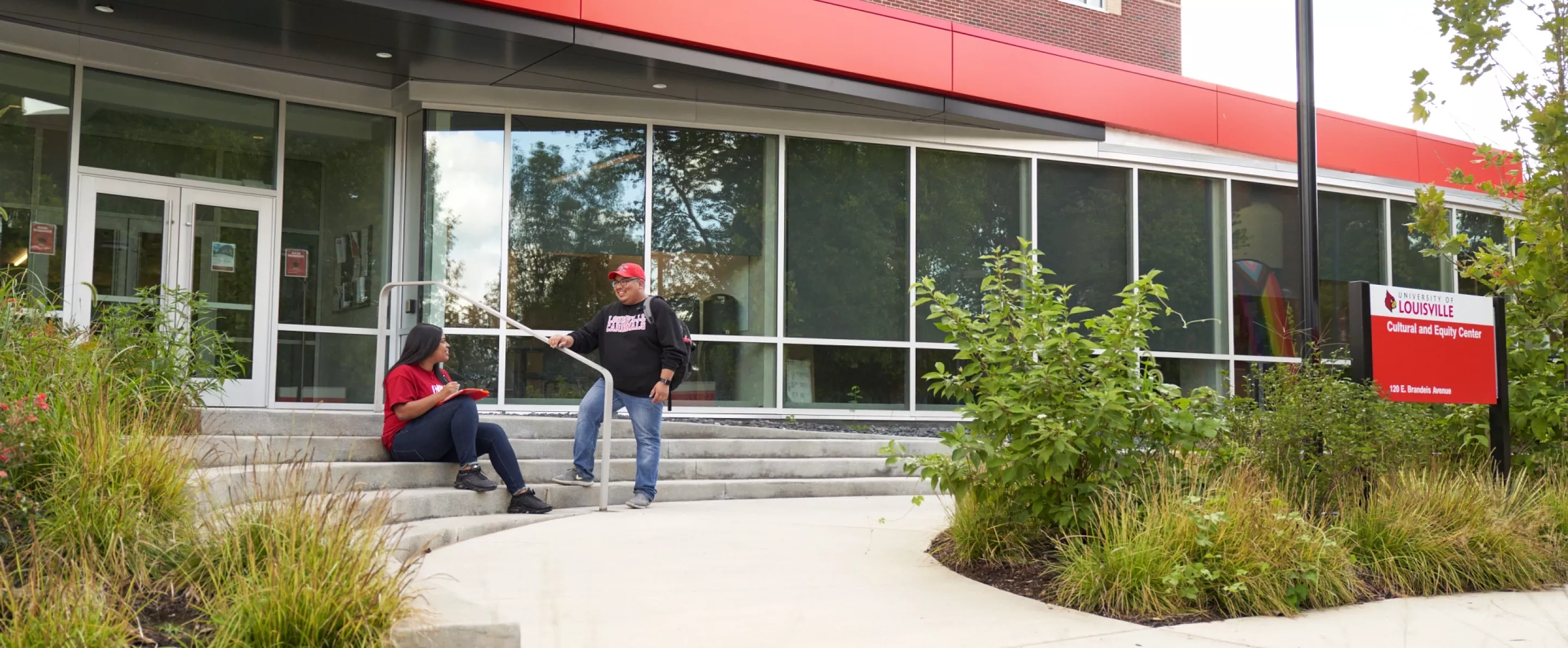 Two students talk outside the Cultural and Equity Center.