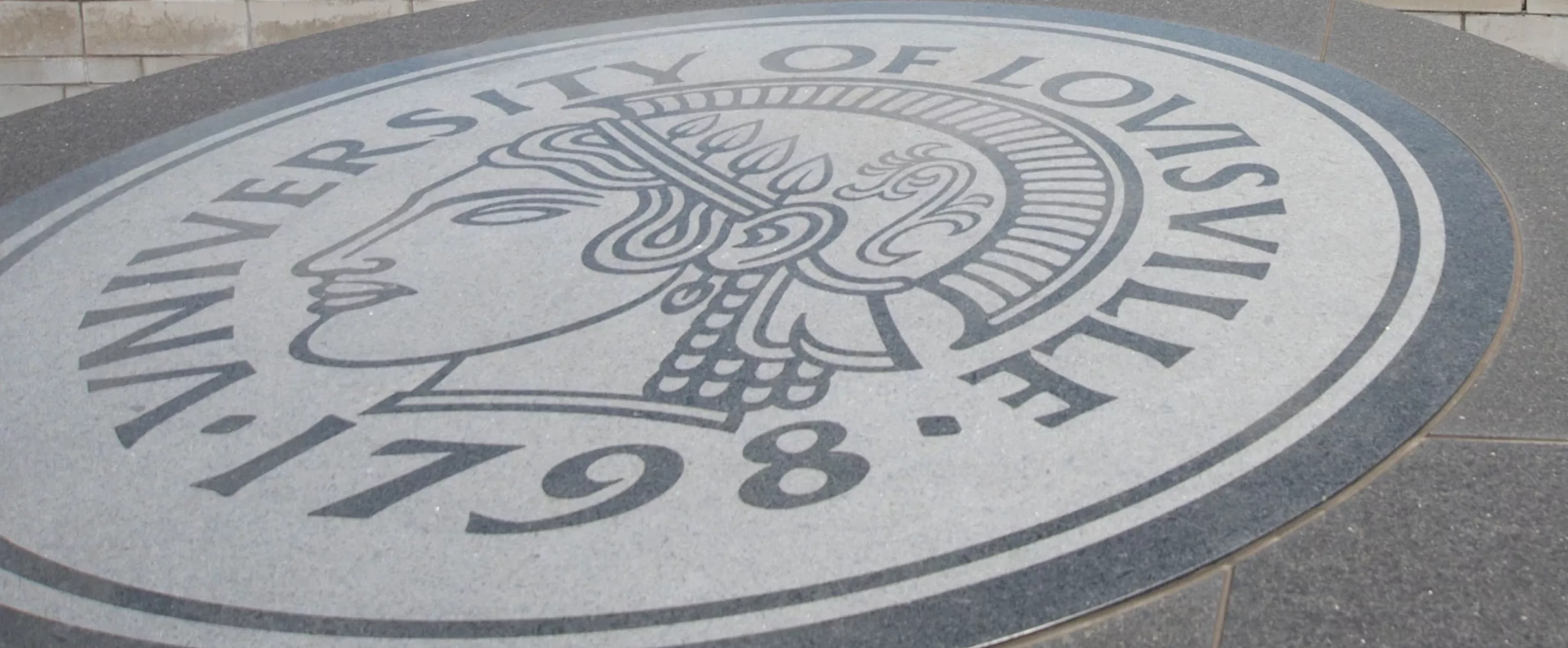 The University of Louisville Minerva seal in granite.