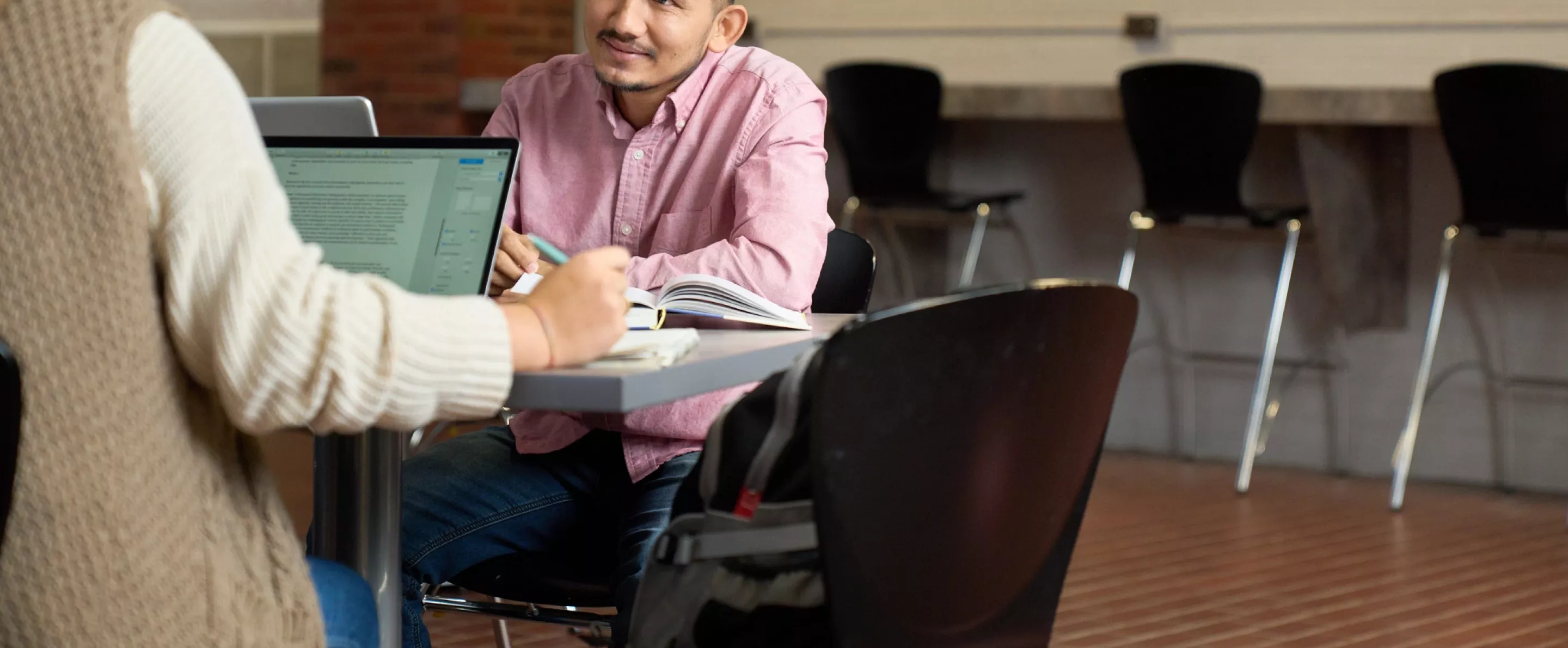 Students talking and studying.