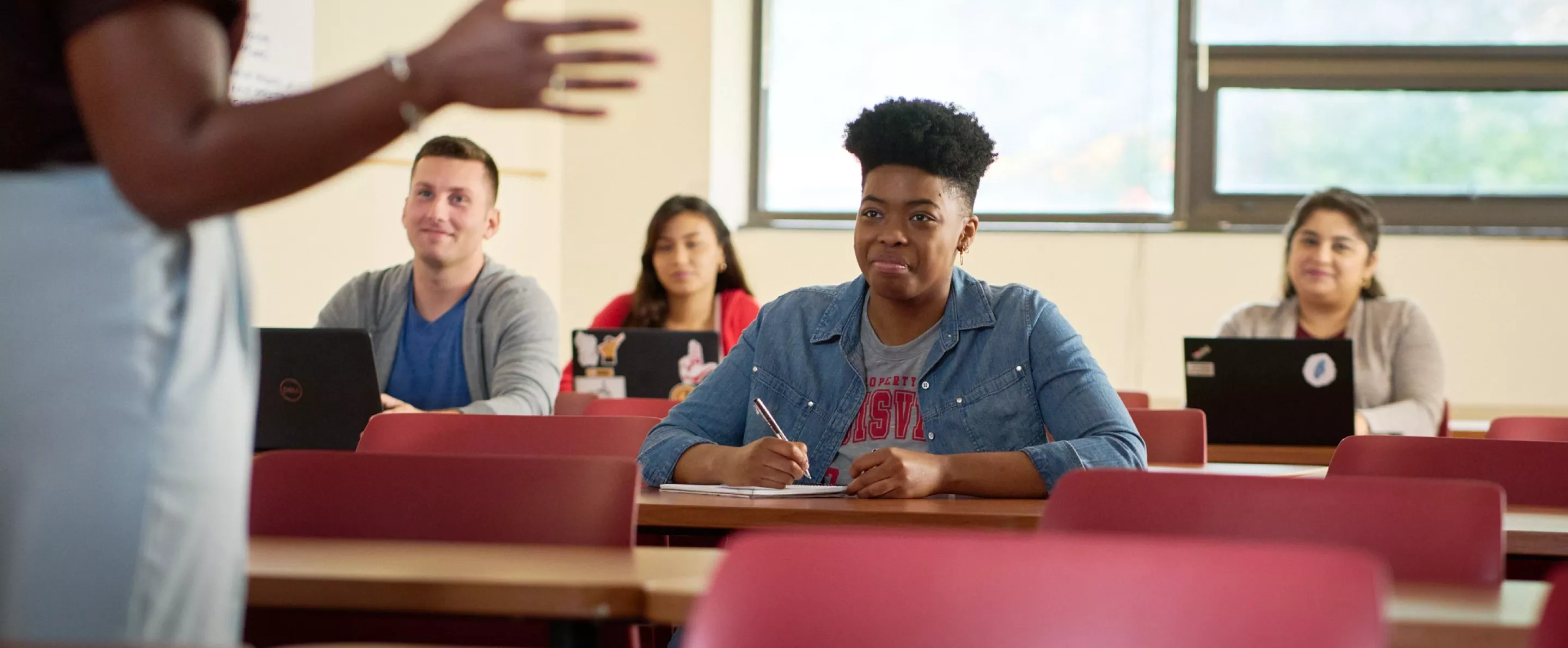 Female professor teaches her class.