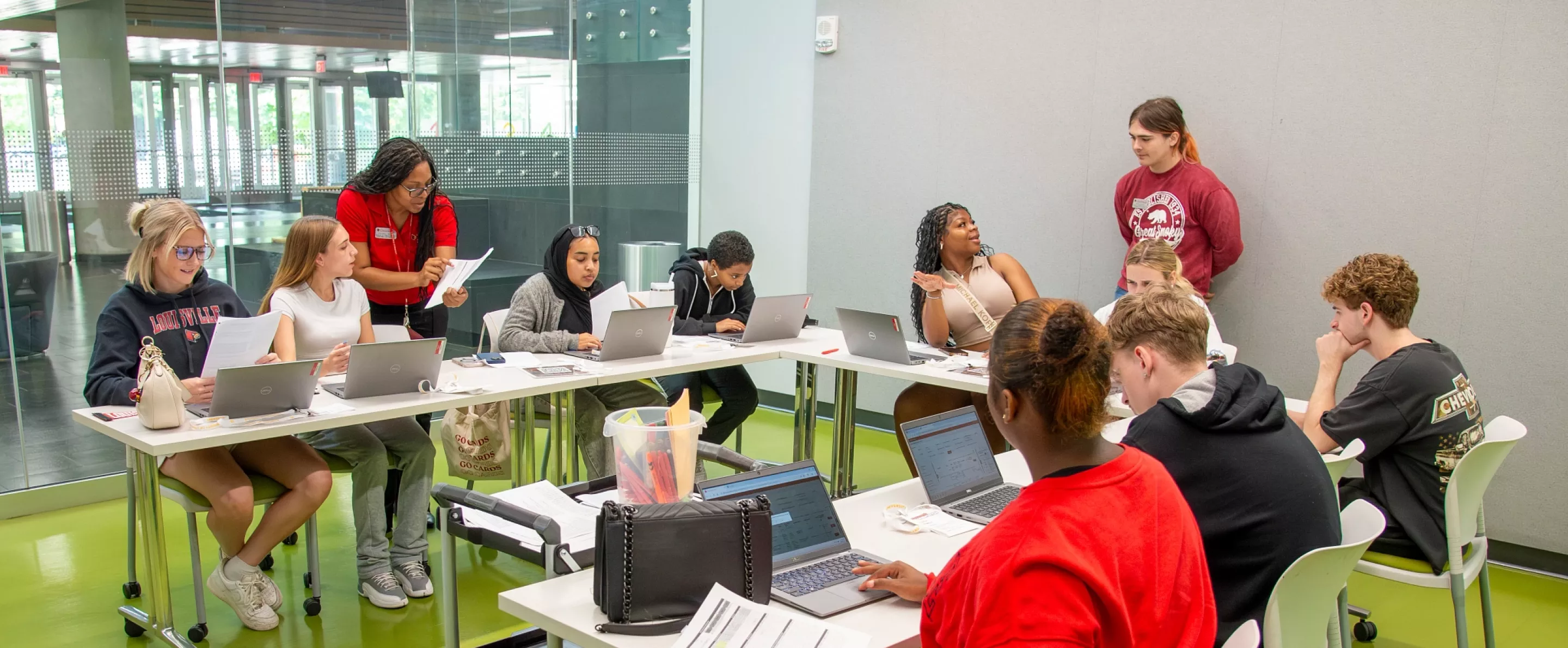 Advisors and student ambassadors meet with students during freshman orientation to discuss class options and help new…
