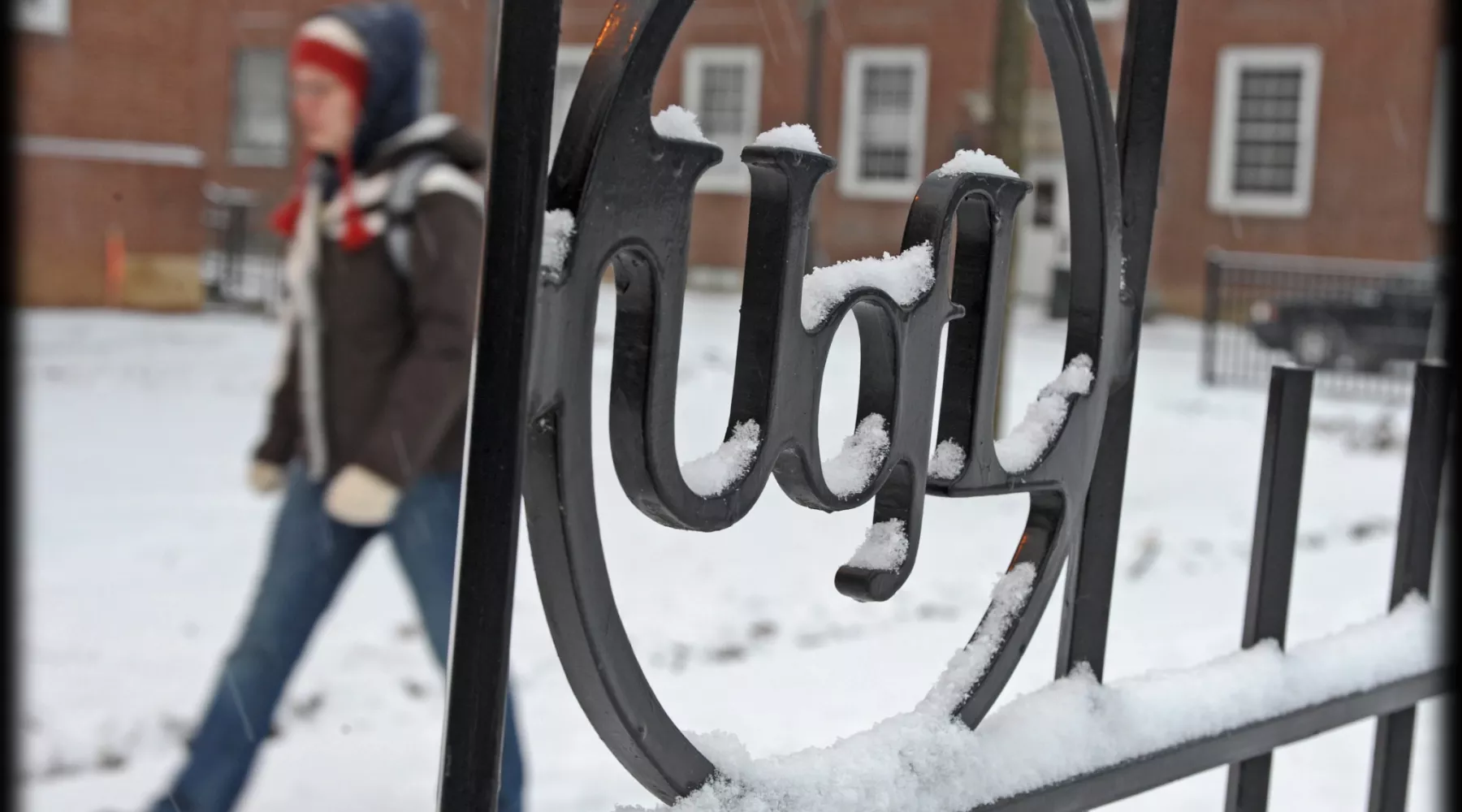 Architectural detail of wrought iron fence in the snow