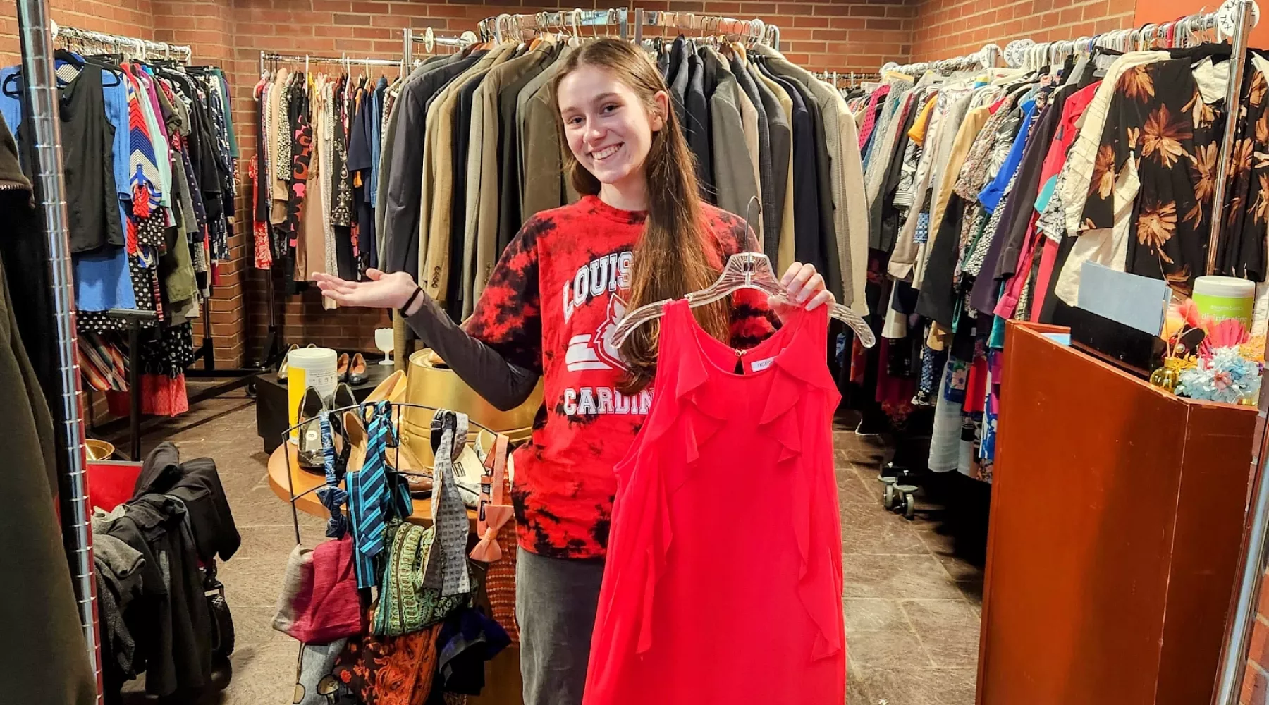 Student showing off Hire Attire location