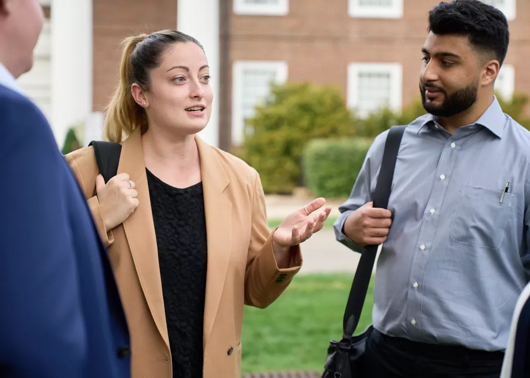 Law students talking in the courtyard of the Brandeis School of Law.