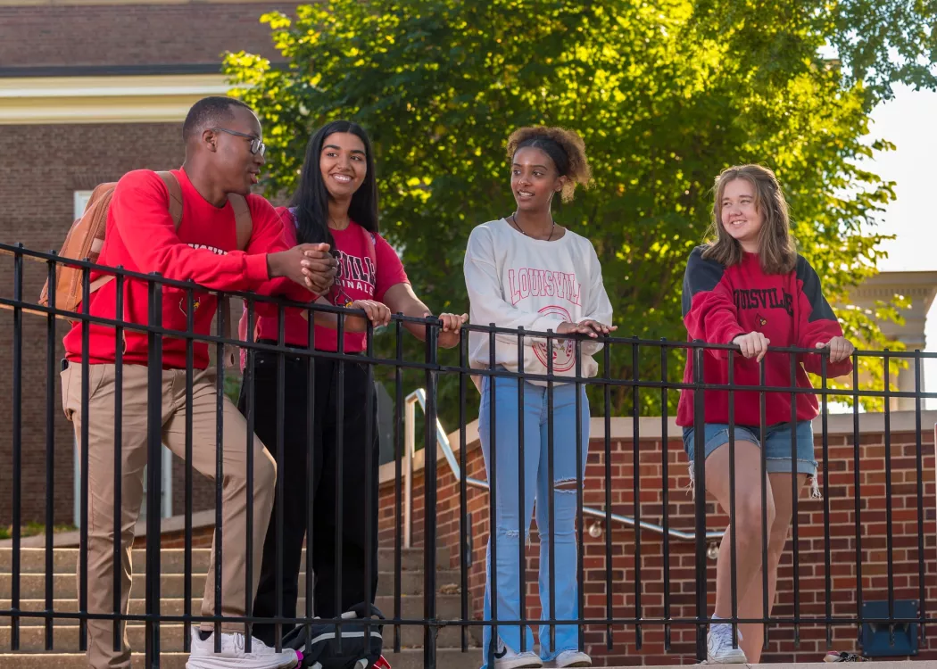 A group of students talking on campus