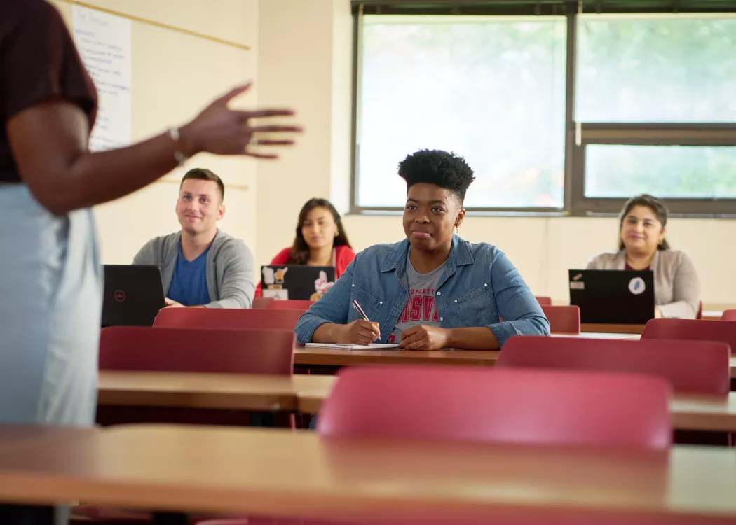 Female professor teaches her class.