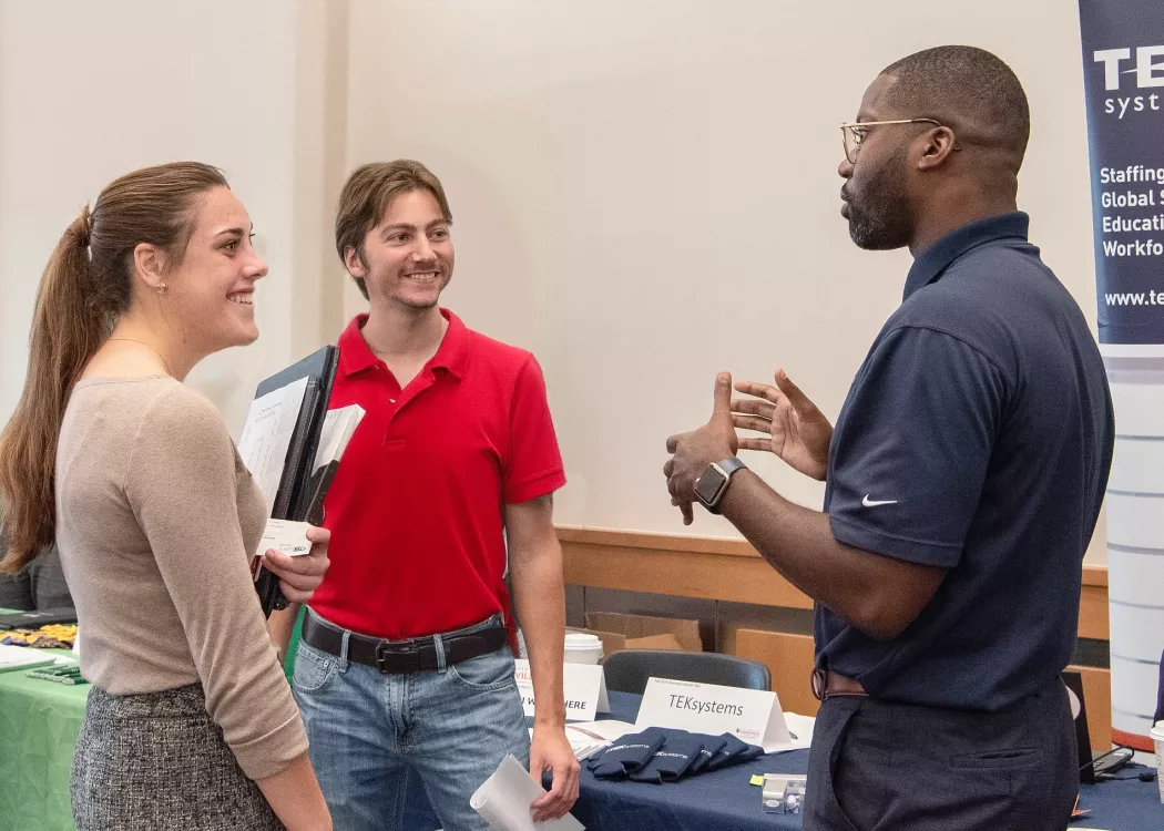 Students talking to an employer at the Career Fair