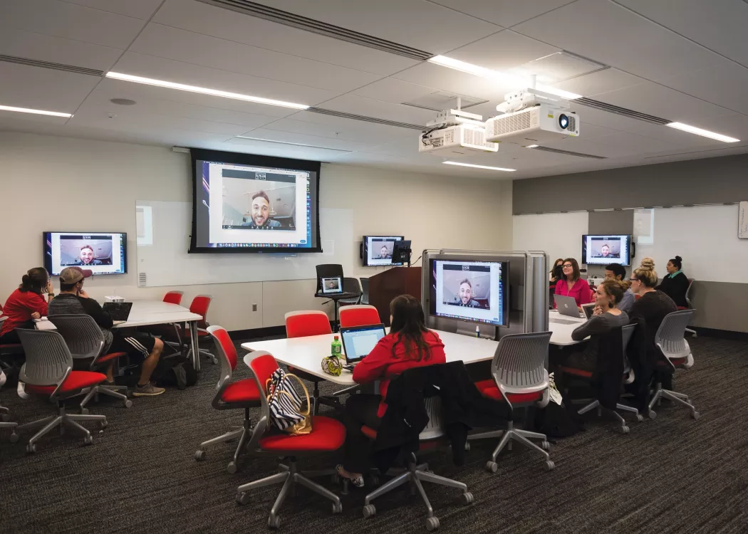 Students using video conferencing in a classroom