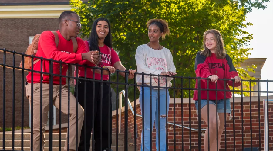 A group of students talking on campus