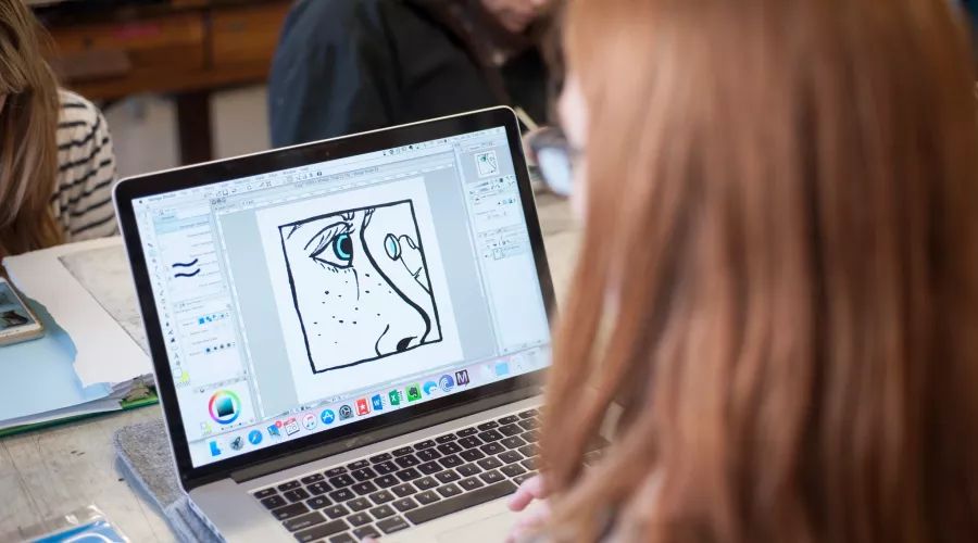 Student works on a project in printmaking