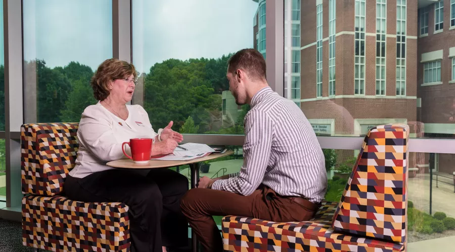 Female supervisor having a meeting with male employee