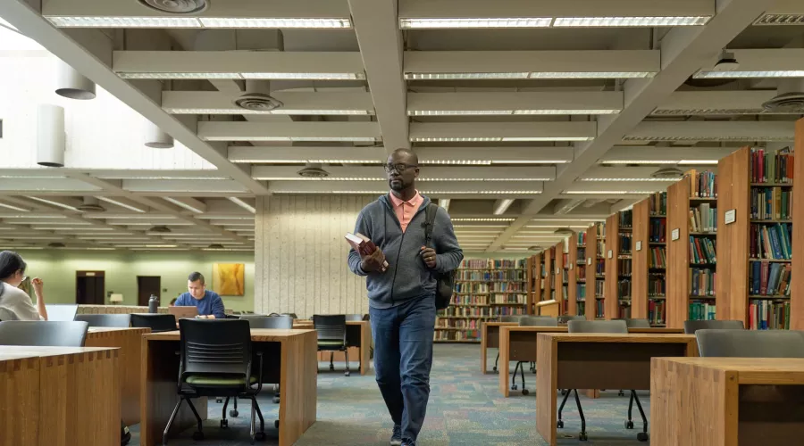 Student walks into the library.