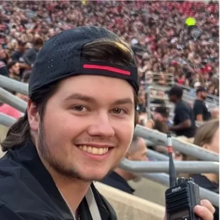 Holding a radio in the stadium