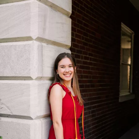 Student posing with cap and tassle