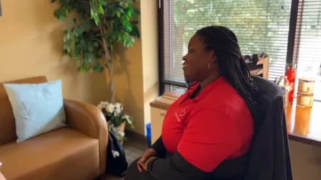 Counselor sitting in a chair listening